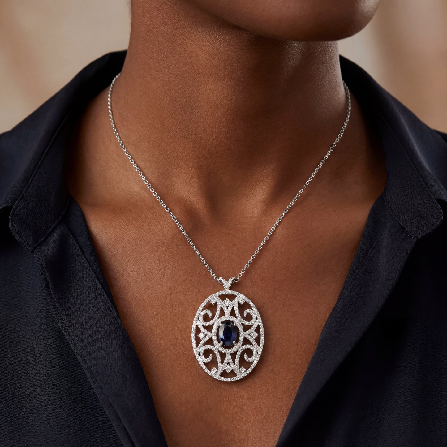 18k White Gold Oval Pendant With A Oval Sapphire In The Center