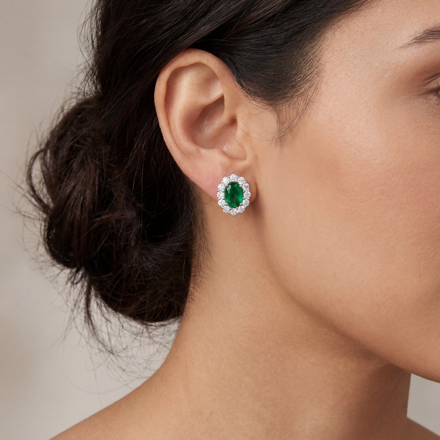 18k White Gold Emerald and Diamond Halo Studs.