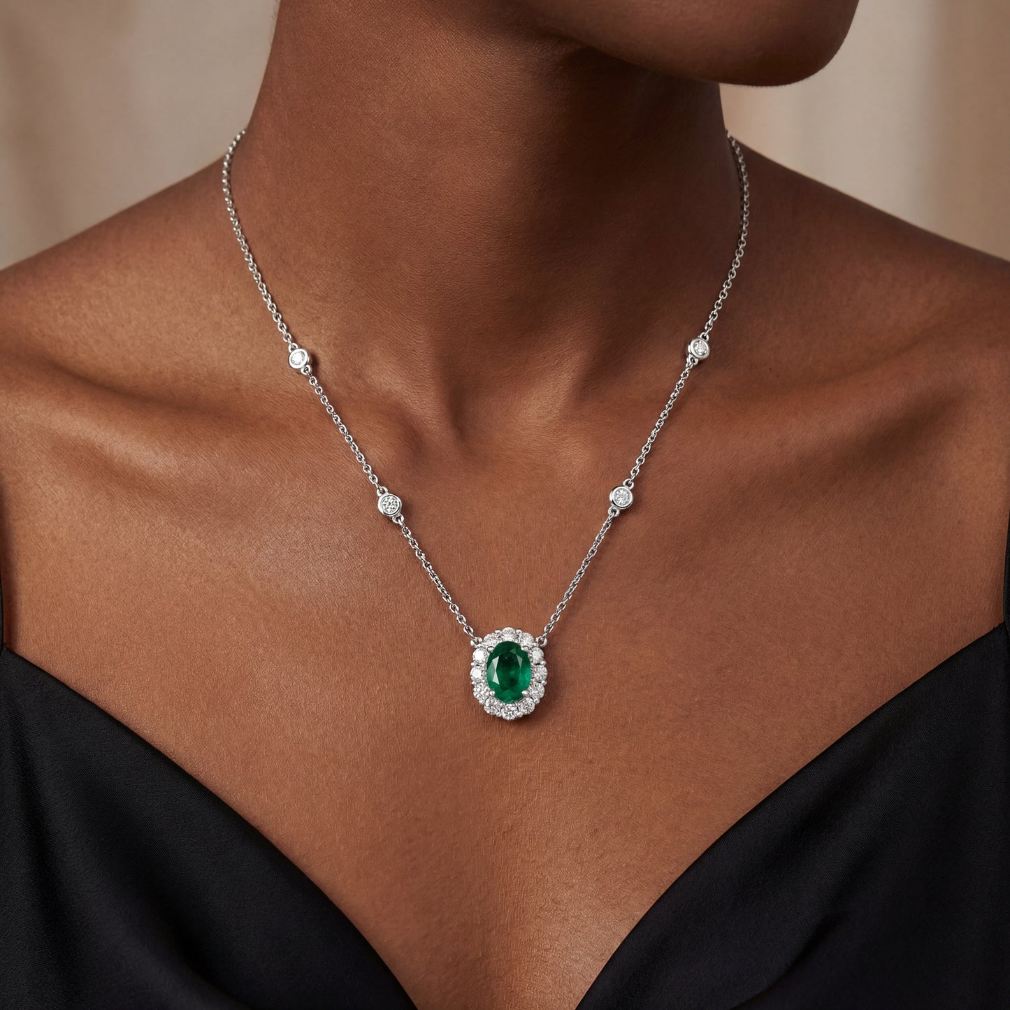 14K White Gold Emerald and Diamond Halo Necklace