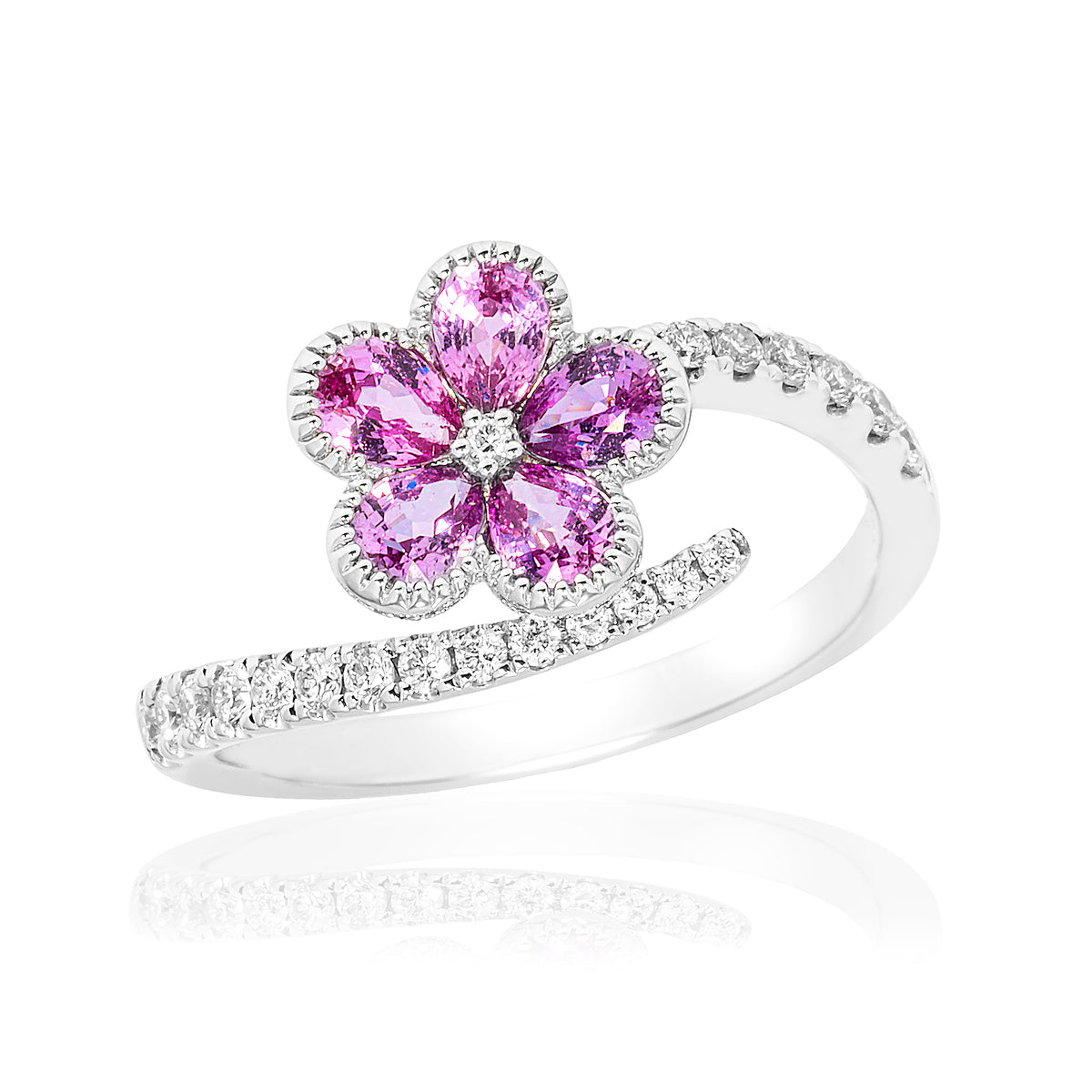 18k white gold pink sapphire flower and diamond bypass ring.
