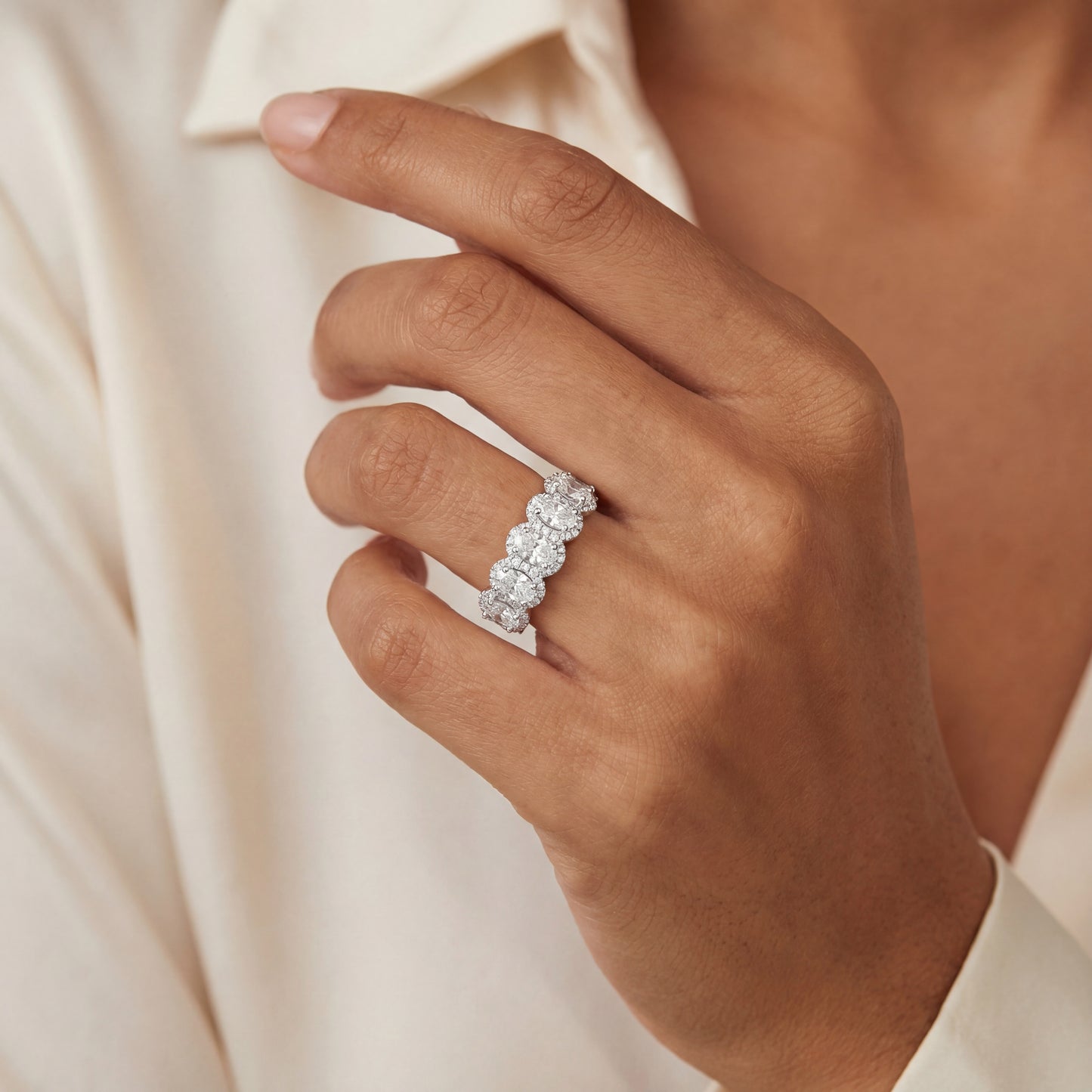 14k White Gold 7 Stone Oval Halo Ring.